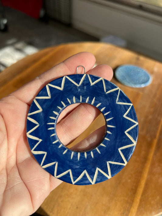 Carved blue ornament in deep blue