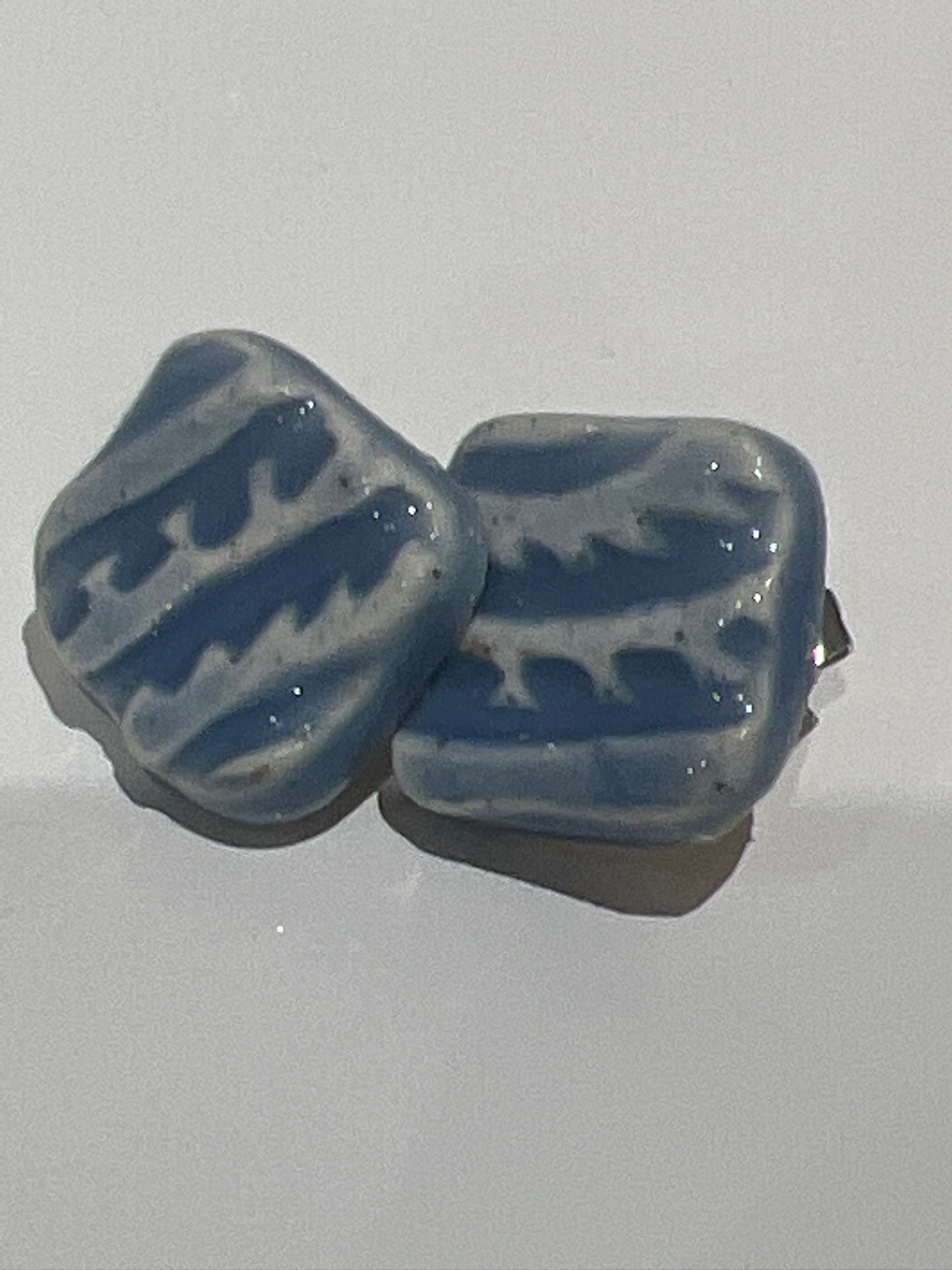 Square textured earrings in sky