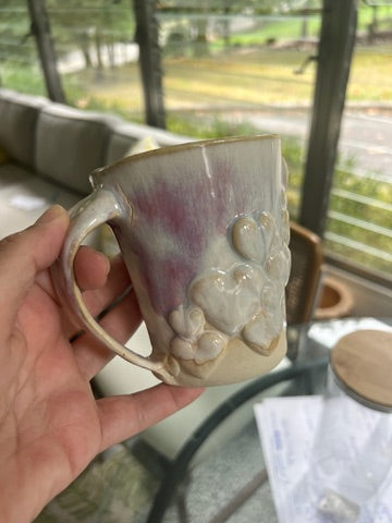 Pink and white mug with heart detailing